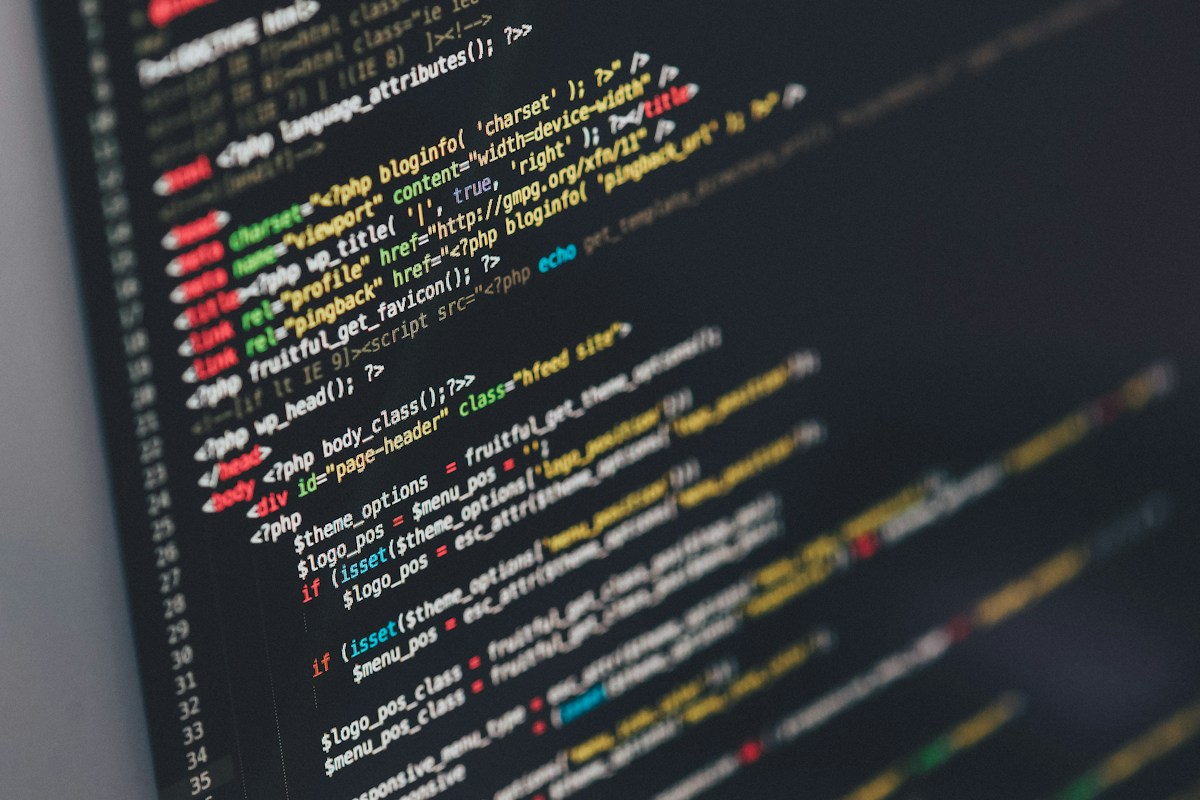 Code on a monitor in a dark room